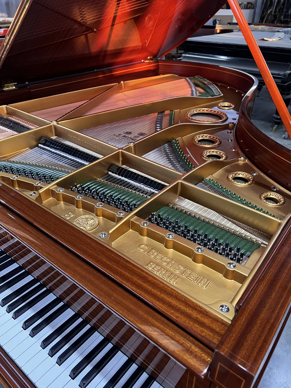 Soundboard, strings and restored mahogany case of our 1897 Bechstein
